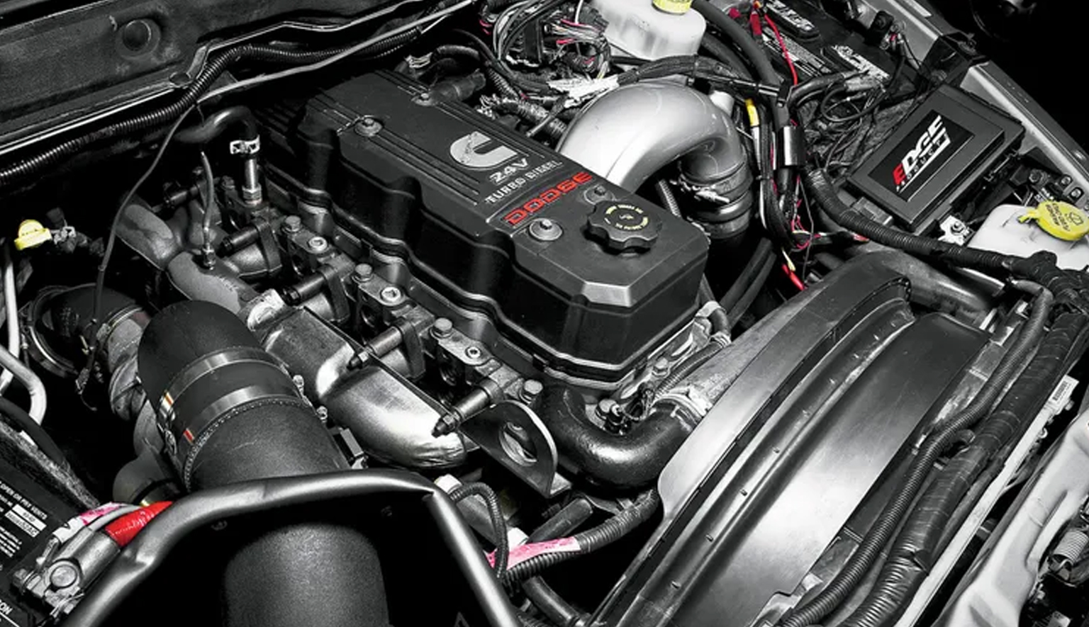 Technician performing Cummins diesel diagnostics on a light or medium duty truck