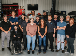 Lonsbury Garage team smiling together